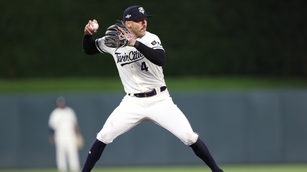 Oct 11, 2023; Minneapolis, Minnesota, USA; Minnesota Twins shortstop Carlos Correa (4) fields a ground ball in the third inning against the Houston Astros during game four of the ALDS for the 2023 MLB playoffs at Target Field.